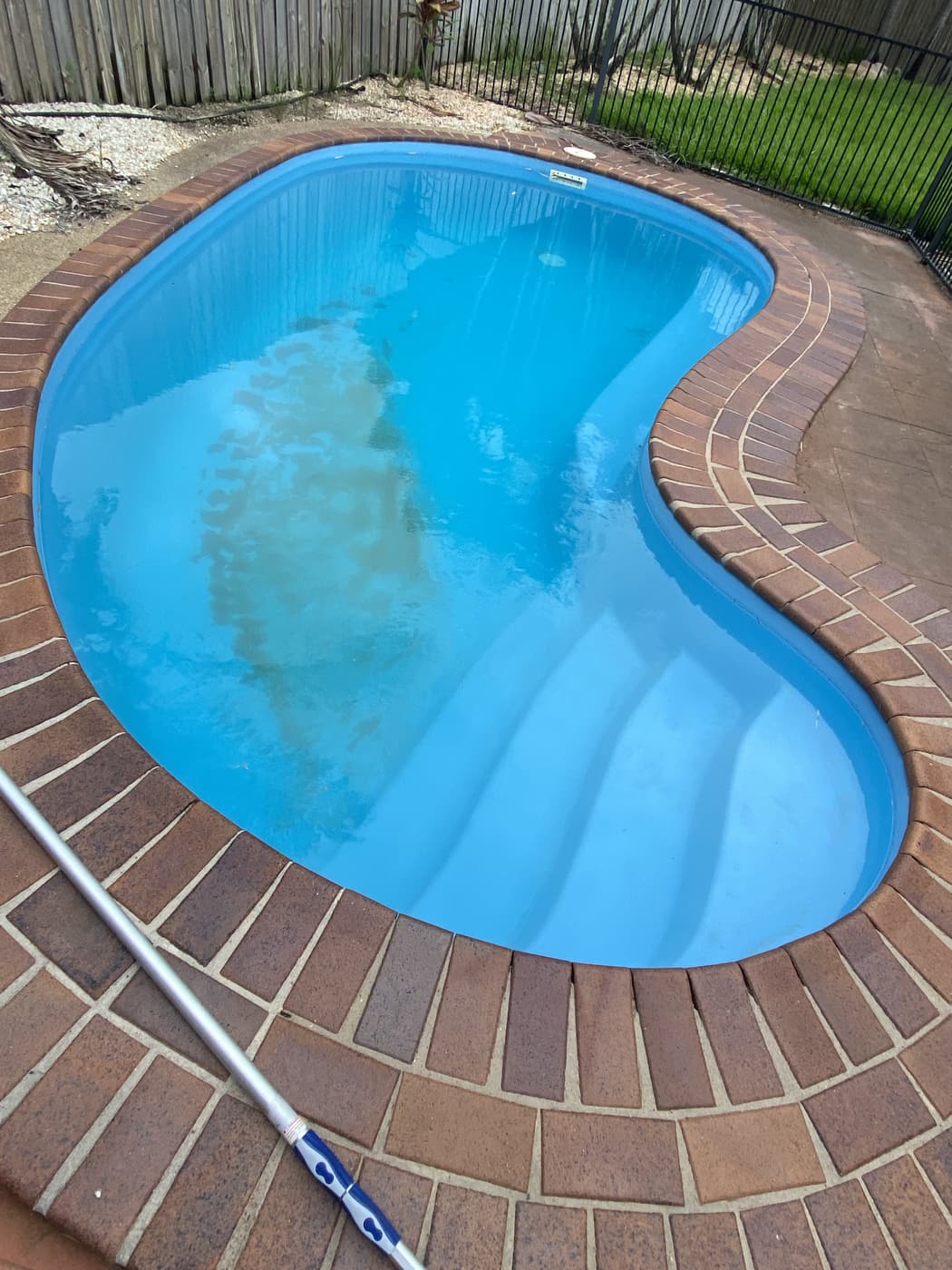 Same Townsville kidney pool clear and blue after green pool recovery service